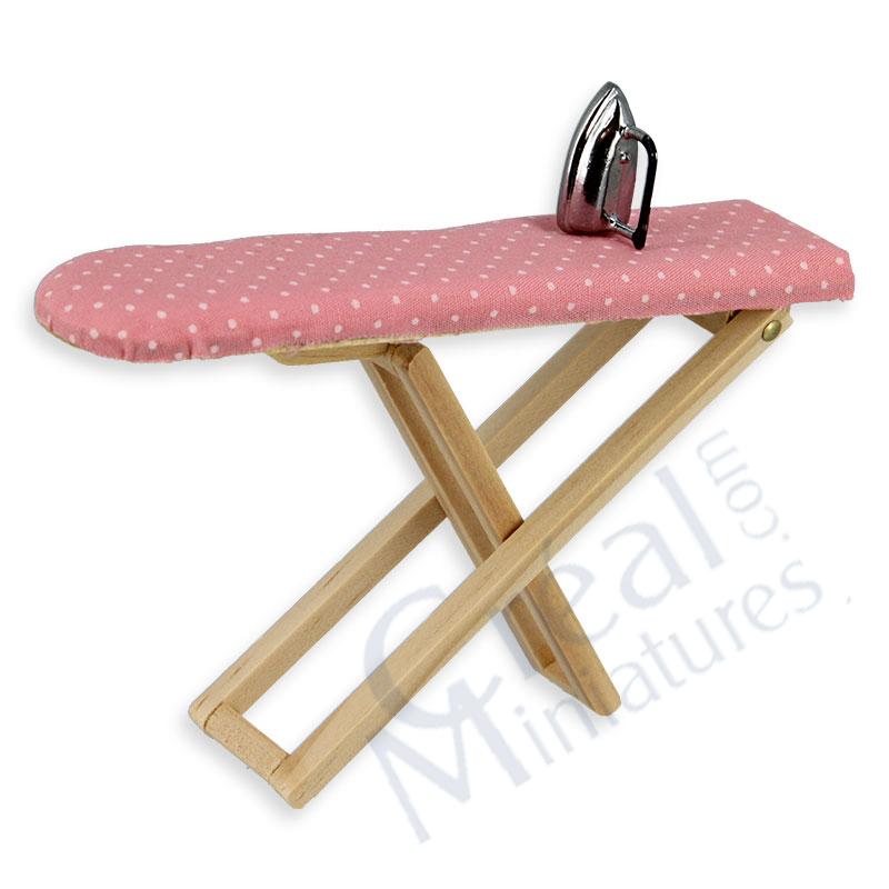 Ironing board with pink cover and iron
