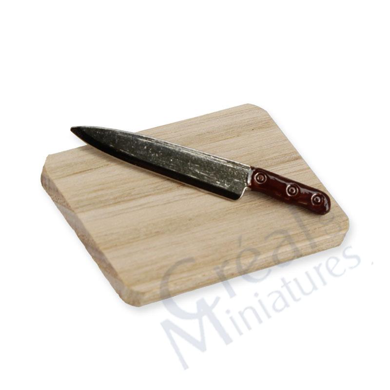 Wooden cutting board with knife