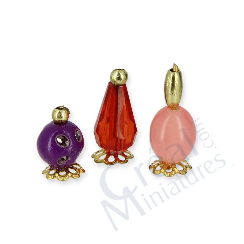 3 perfume bottles ass.