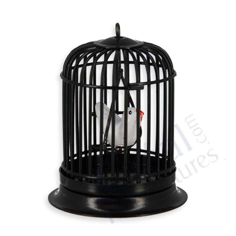 Cage à oiseau ronde noire avec oiseau