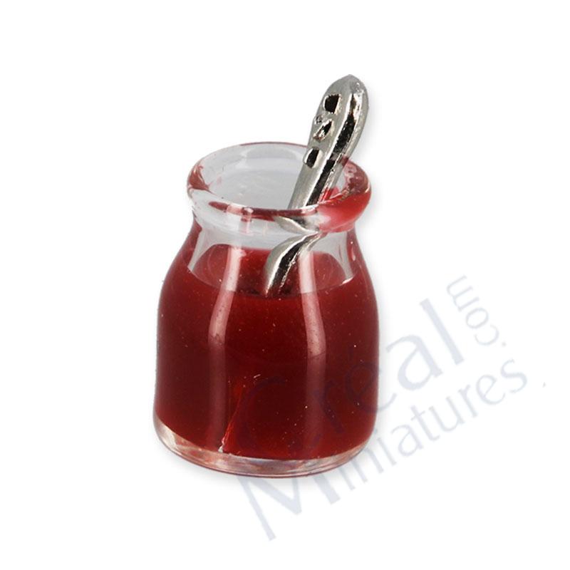 Strawberry jam jar with spoon